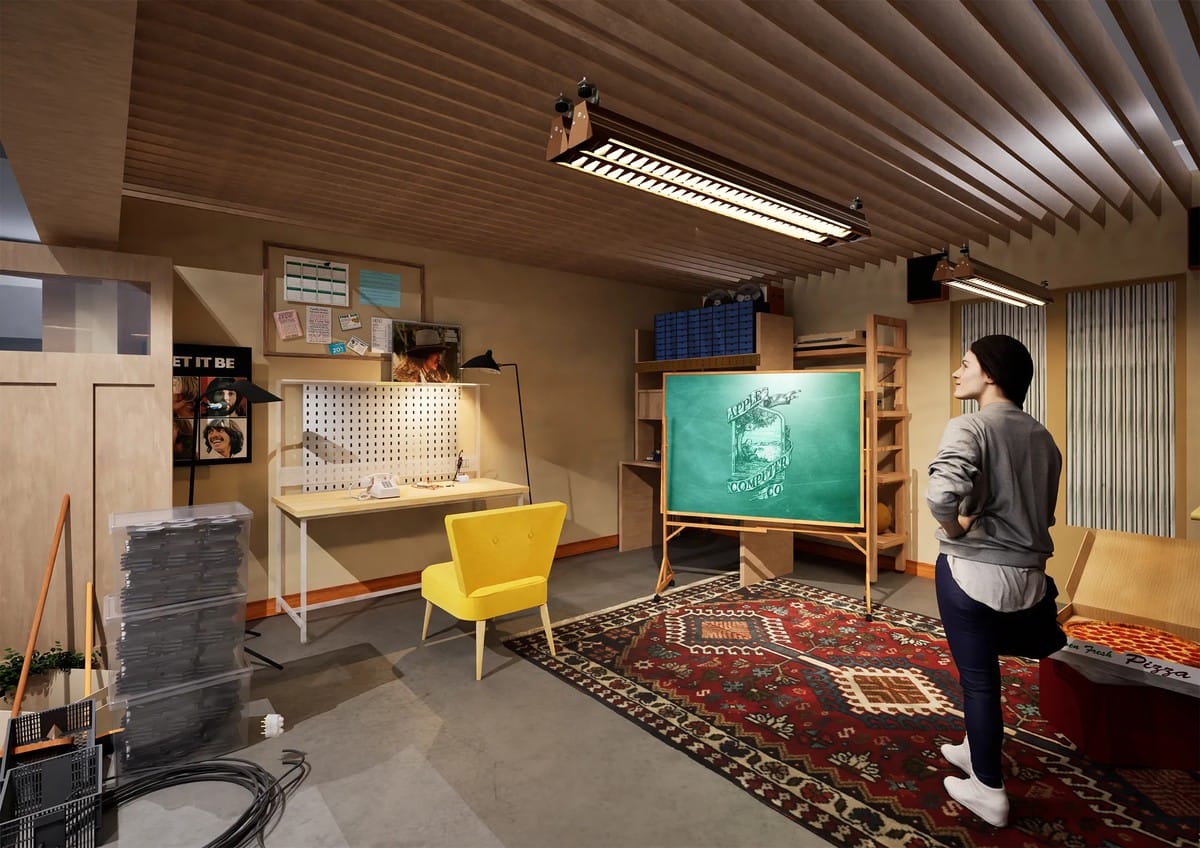 A wide view of the Apple Museum collection showing various classic computers on display tables