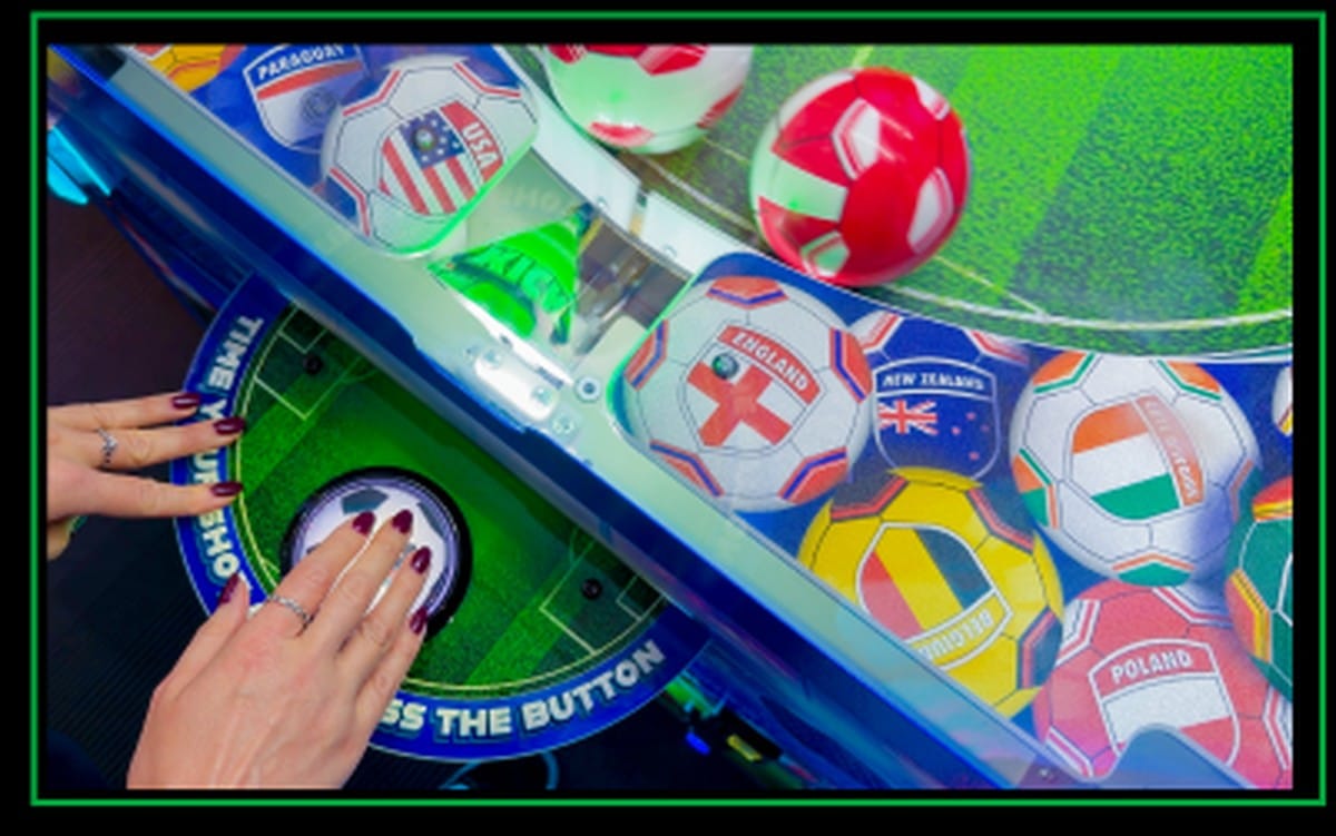 Kick N Win gameplay field showing the rotating balls and center hole