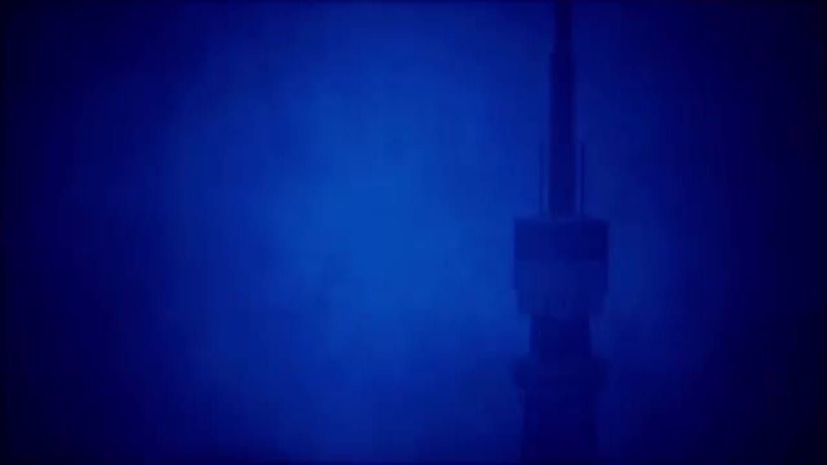 First-person perspective of the character climbing the red metal structure of the tower during a storm.