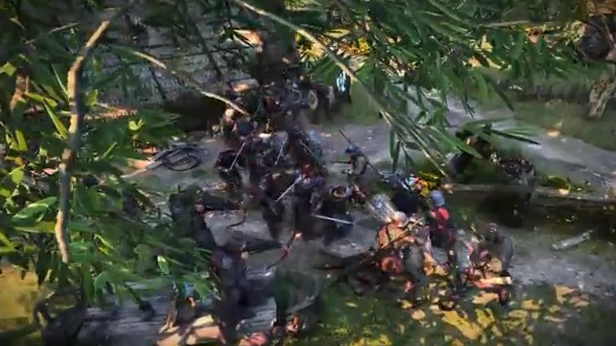 A large-scale melee battle between two groups of armored soldiers in a field.