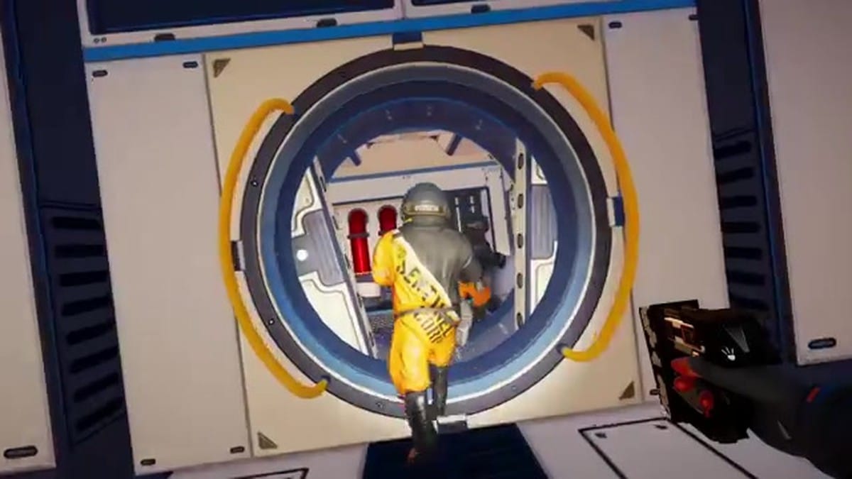 A group of players in orange space suits running together into a base module