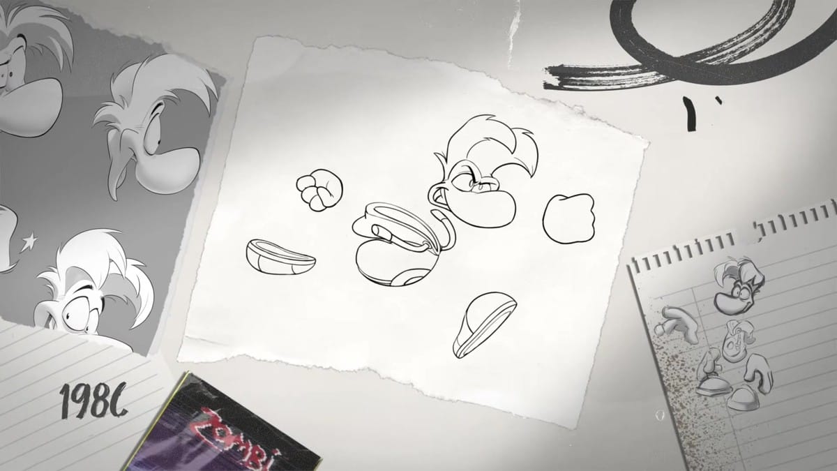 Rayman's early design being sketched on a piece of paper with '1986' visible in the background.