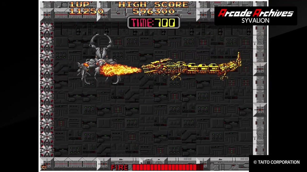 The dragon battling a large mechanical spider boss