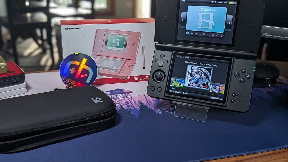 The Anbernic RG DS Plus dual-screen handheld console displaying a game