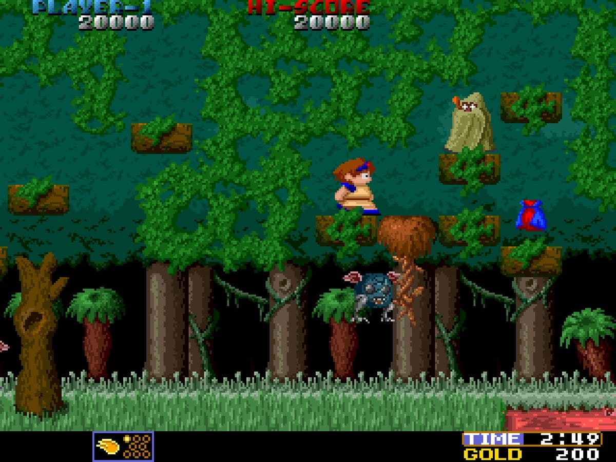 Wardner arcade gameplay screenshot showing a character jumping over a gap