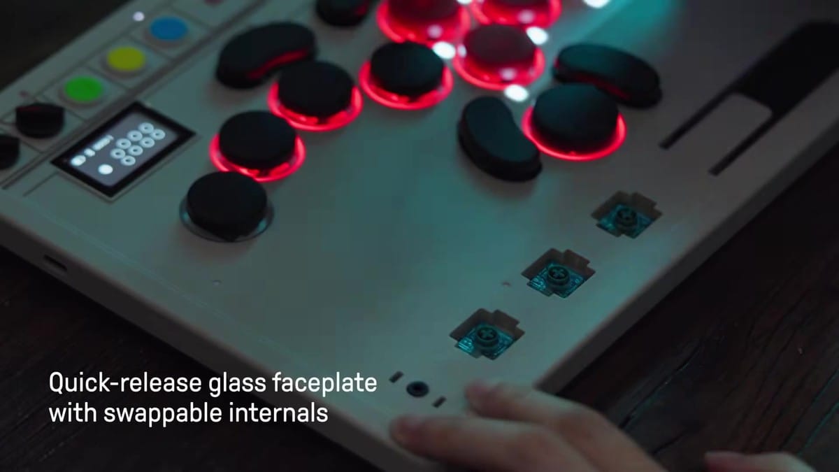 Removal of the quick-release glass faceplate to expose swappable internals and button layout options