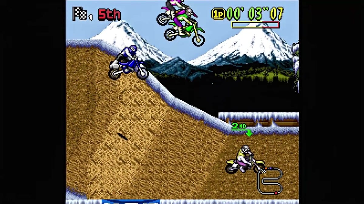 Bikes catching massive air in front of a snow-capped mountain backdrop