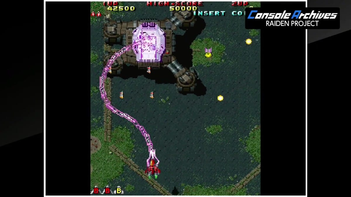 Player ship firing the curving purple plasma beam weapon against a four-legged walker boss in Raiden II