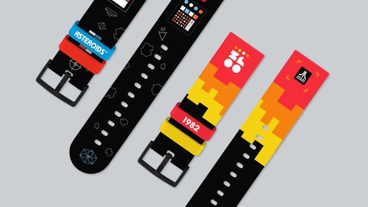 Two Atari smartwatch bands featuring Asteroids and 1982 retro designs