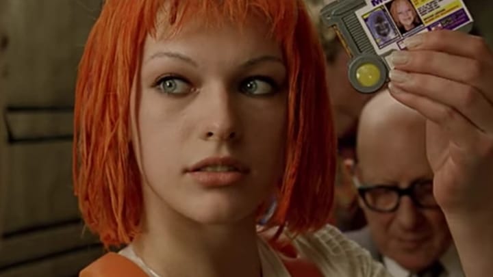 Milla Jovovich as Leeloo in The Fifth Element holding a multipass