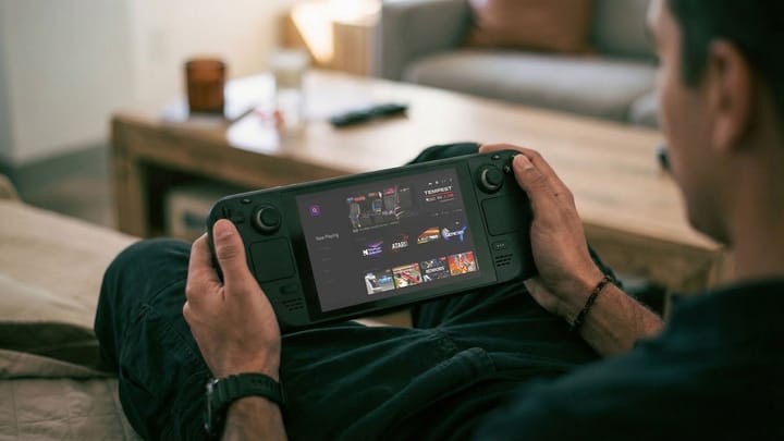 Featured image showing the Polymega Remix device connected to a laptop, with various retro game cartridges and CD cases nearby.