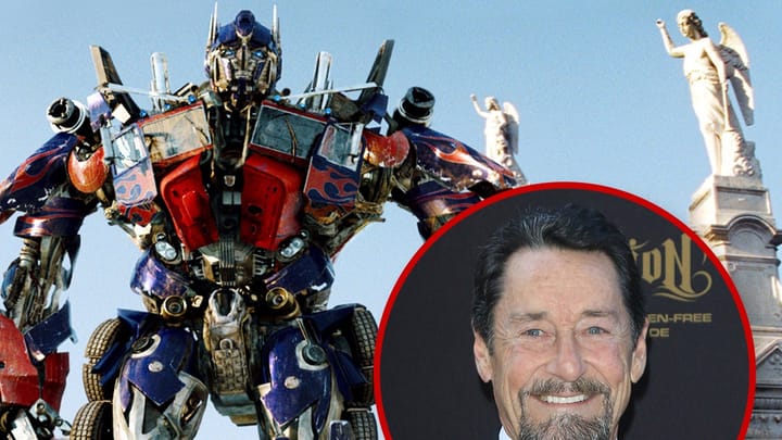 Peter Cullen speaking at a microphone